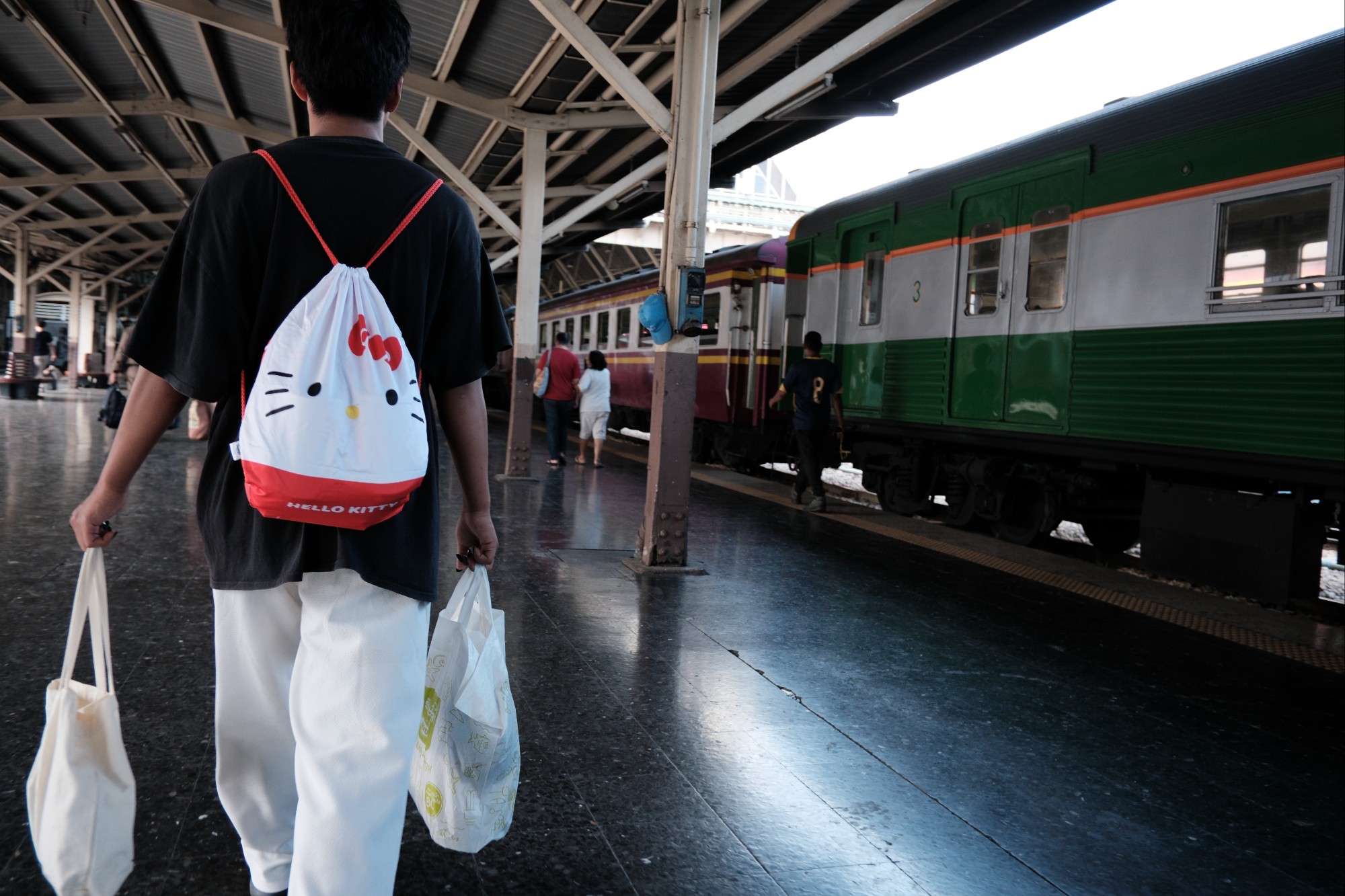 Guy leaving train station, Bangkok, Thailand – gsworldphoto